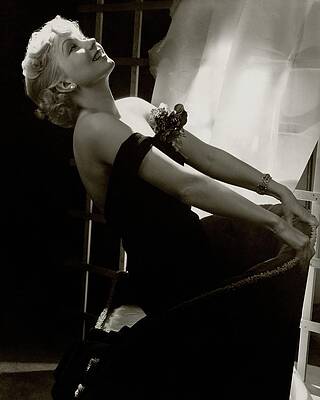 Wall Art featuring the photograph Ann Sothern Kneeling On An Armchair by Lusha Nelson