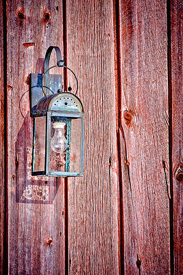 Wall Art featuring the photograph Antique Lantern On Weathered Red Barn by Jeff Sinon