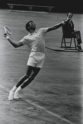 Tennis Player Serving in Action Photograph