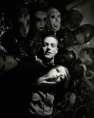 Man Surrounded by Mysterious Masks Photograph