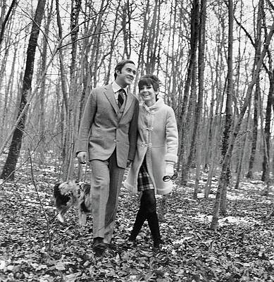 Couple Walking in Winter Forest Photograph