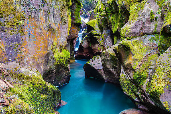 Serene Mountain Gorge with Waterfall Photograph
