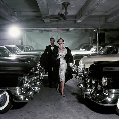 Elegant Couple in Vintage Car Garage Photograph