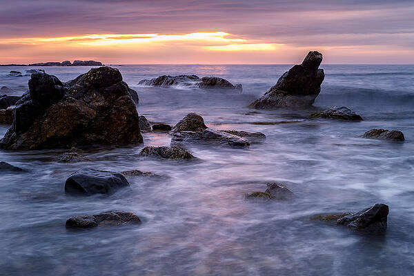 Reflection Wall Art featuring the photograph Boulders In The Surf by Jeff Sinon