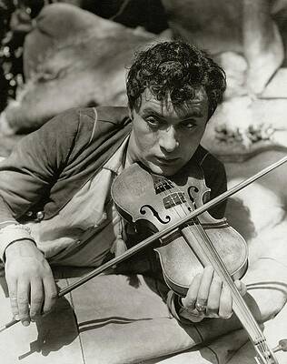 Wall Art featuring the photograph Charles Boyer Playing A Violin by George Hoyningen-Huene