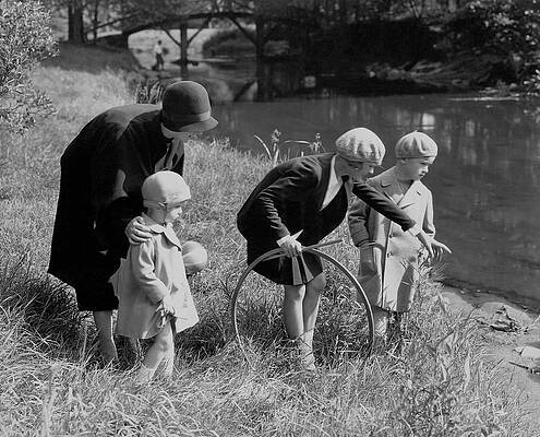 Family Strolling by Riverside Wall Art