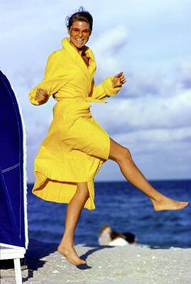 Happy Photograph - Christie Brinkley Wearing A Yellow Robe by Arthur Elgort