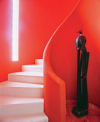 Spiral Staircase with African Sculpture Photograph