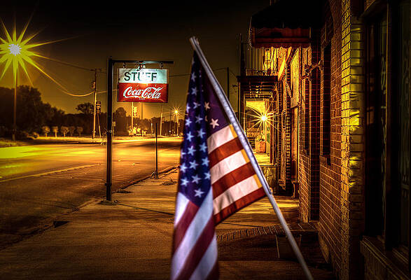 American Flag on a Night Street Photograph