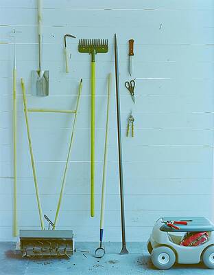 Organized Garden Tools Against Wall Wall Art