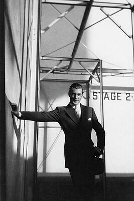 Elegantly Dressed Man Against Modern Architecture Wall Art