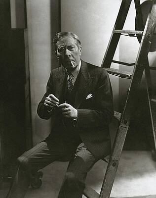 Wall Art featuring the photograph George Arliss Sitting On A Ladder by Lusha Nelson