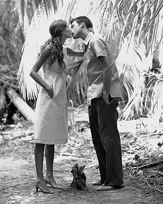 Couple Kissing in Tropical Setting Photograph