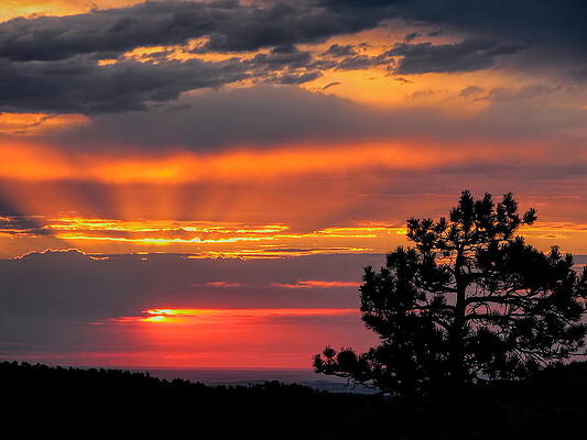 Wall Art featuring the photograph God's Spotlight Over Keystone by Dale Kauzlaric