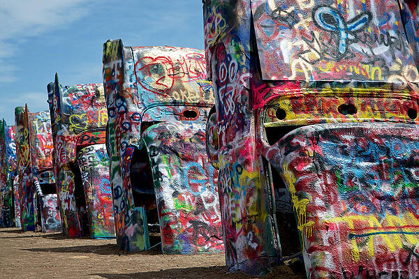 Graffiti-Covered Cadillacs in a Field Photograph