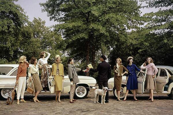 Fashionable Group Posing by Classic Cars Photograph