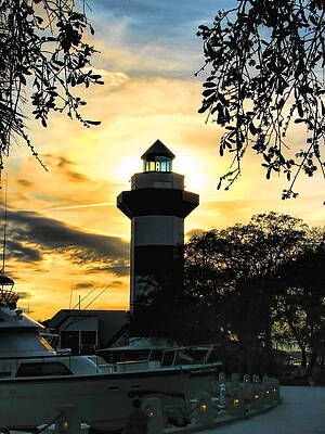 Cloud Wall Art featuring the photograph Harbour Town Lighthouse Beacon by Dale Kauzlaric