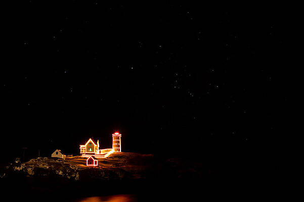 Maine Wall Art featuring the photograph Holiday Lights At Nubble Light by Jeff Sinon