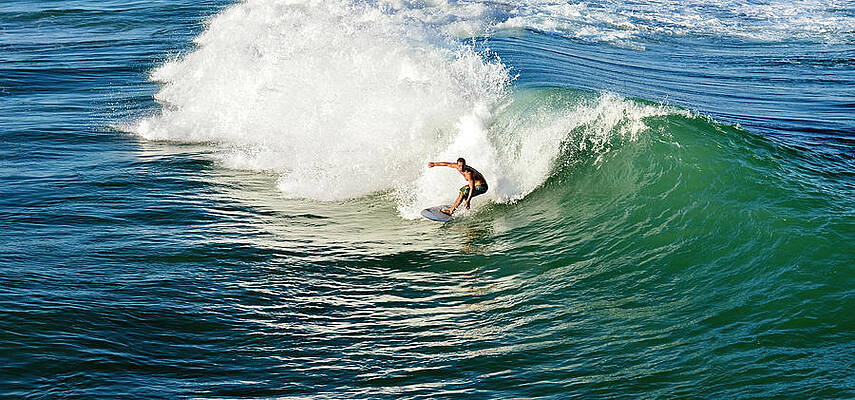 Surfer Riding a Large Wave Wall Art