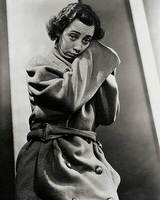 Wall Art featuring the photograph Imogene Coca Wearing An Oversized Coat by Lusha Nelson