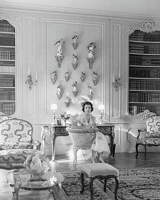 Elegant Woman in a Luxurious Library Photograph