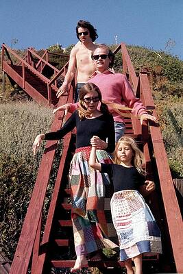 Family Walking Down Red Stairs Wall Art