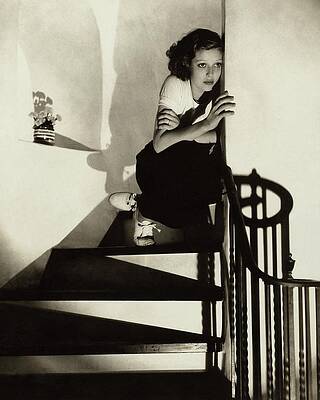 Pensive Woman on Staircase Photograph