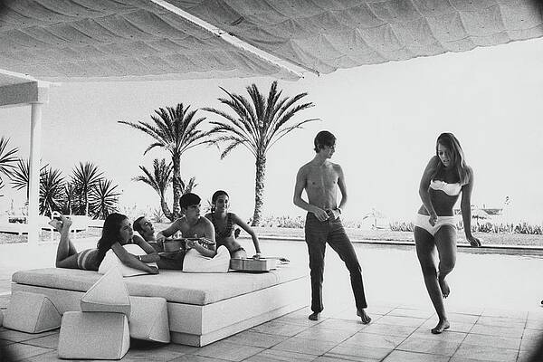 Poolside Gathering with Palm Trees Photograph