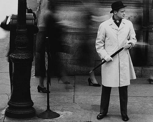 Wall Art featuring the photograph Man Wearing A Raincoat by John Rawlings