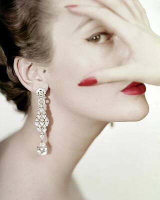 Elegant Woman with Bold Earrings Wall Art