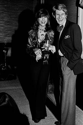 Elegant Couple at Evening Event Photograph