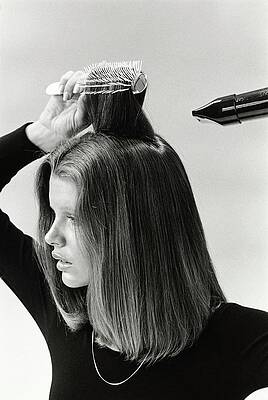 Monochrome Photograph - Model Blow Drying Hair by Mike Reinhardt