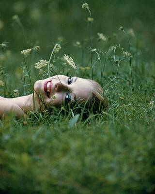 Woman Lying in a Meadow Photograph