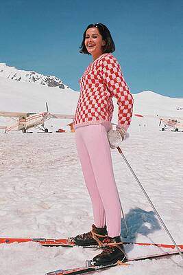 Smiling Woman on Snowy Ski Slope Photograph