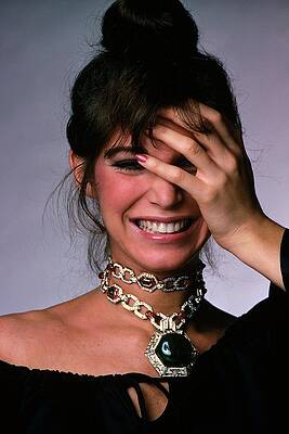 Laughing Woman Adorned with Jewelry Photograph