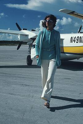 Passenger Wall Art featuring the photograph Model Wearing A Kimberly Ensemble On A Runway by Kourken Pakchanian