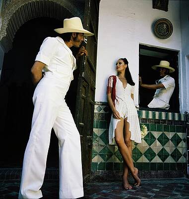 Wall Art featuring the photograph Model Wearing An Adolfo Jumpsuit by Raymundo de Larrain