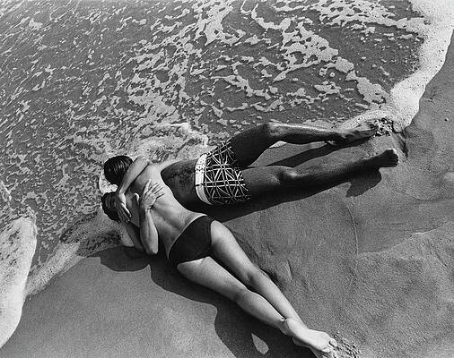 Couple Embracing on a Sandy Beach Wall Art