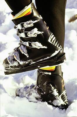 Snow-Covered Ski Boots Photograph