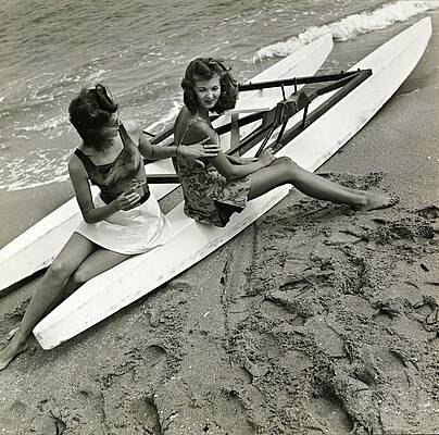 Women Relaxing on a Beach Canoe Photograph