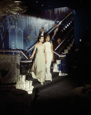 Staircase Photograph - Models Wearing Evening Gowns On A Staircase by John Rawlings