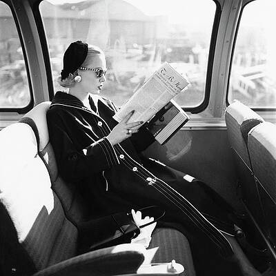 Elegant Woman Reading on a Bus Photograph