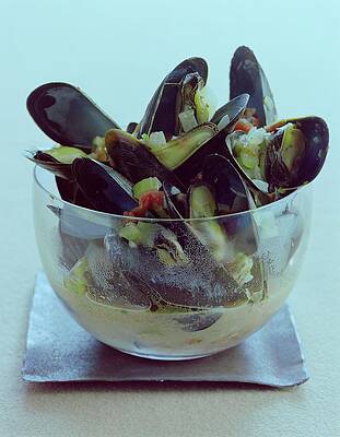 Glass Bowl of Steamed Mussels Photograph