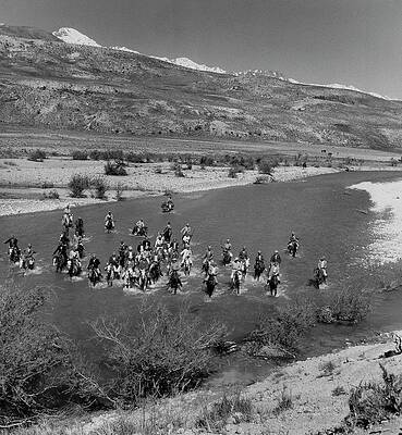 Mountain Photograph - Nomadic Tribesmen Cross A River In Iran by Horst P. Horst
