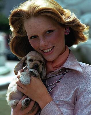 Puppy Wall Art featuring the photograph Patti Hansen Carrying A Puppy by William Connors
