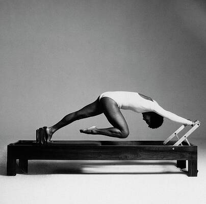 Paula Kelly on Reformer Machine Photograph