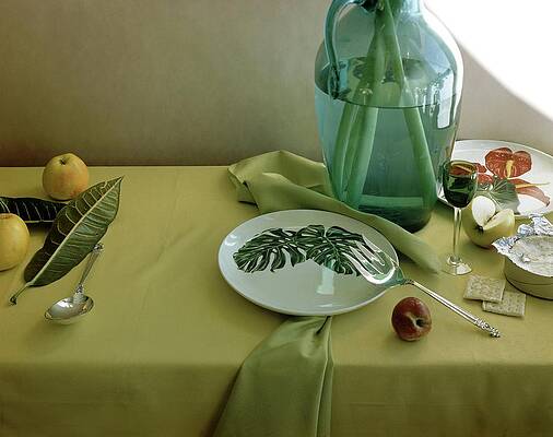Wine Glass Wall Art featuring the photograph Plates, Apples And A Vase On A Green Tablecloth by Horst P. Horst