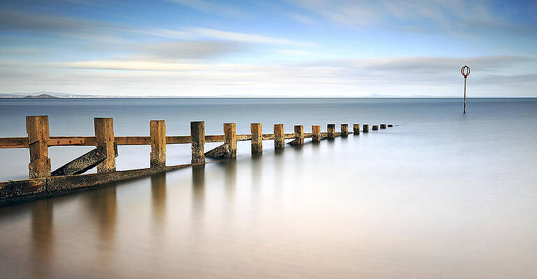 Minimalist Wall Art featuring the photograph Portobello Groynes by Grant Glendinning