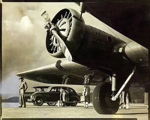 Passenger Wall Art featuring the photograph Propeller Plane With Passengers And Car by George Hurrell