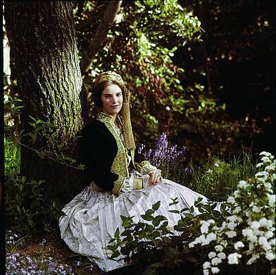 Woman in Traditional Dress in Forest Photograph